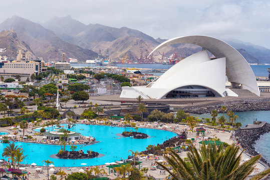 Santa Cruz de Tenerife, Spain - June 16, 2018: Santa Cruz de tenerife cityscape, pools and auditorium in the foreground city Harbor in the background, Canary islands, Spain.