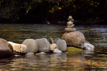 stacked rocks in a river