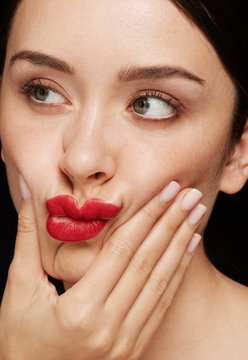 Woman smushing face beauty shot