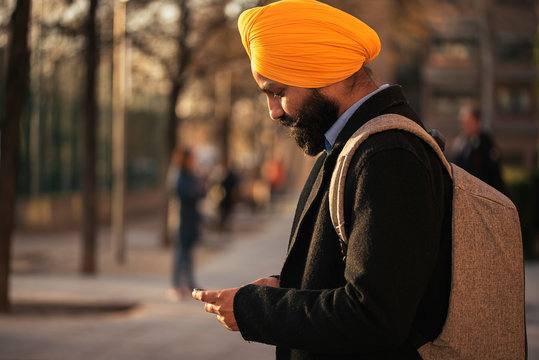 Young handsome Indian Sikh in the street
