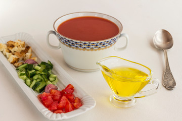 Obraz na płótnie Canvas Summer cold tomato soup. Set of products for gazpacho, white background.