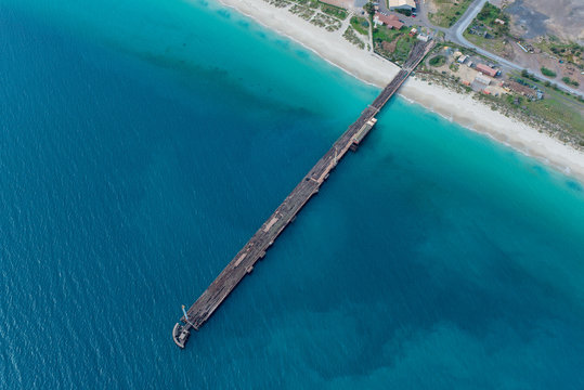Aerial views on Old Wooden dock on the Beach Western Australia