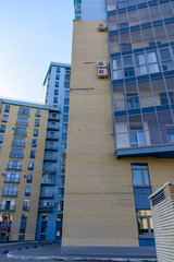 Kazan, Russia - May 9, 2019: Curved multi-storey building with a lot of glazed balconies. Creative design of modern residential complexes.