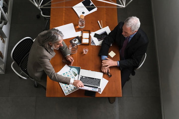 Two businessmen working on a project in the office