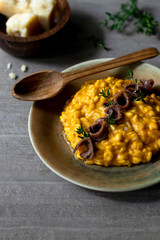 Pumpkin risotto with anchovies and thyme 