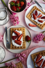 Homemade belgian Waffle. Strawberies and whiped cream.