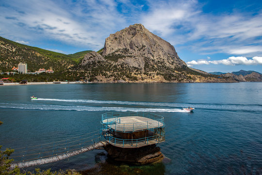 Observation deck on the mountain and two boat