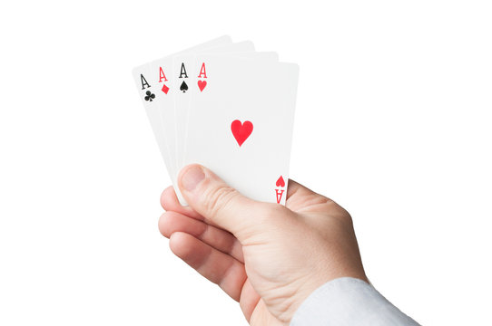 A man's hand hold four aces on white background, image for gambling, luck, win or entertainment purpose