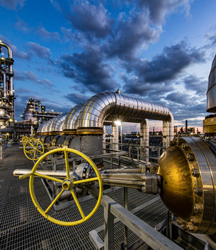 Dusk as viewed through pipe in refinery