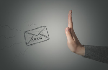 Stop spam concept. Stop gesture by female hand and spam letter on gray background. - obrazy, fototapety, plakaty