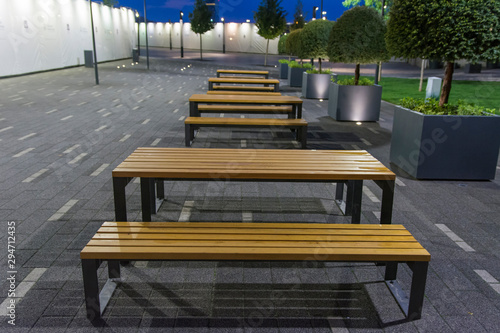 Neatly Set Tables With Benches For Rest In The City Park Stock