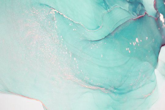 Abstract created using the technique of Alcohol ink. Macro photography of the smallest details of a panting. The panting shows how overflows of shades and colors of paint resemble space motifs.