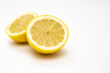  Freshly cut lemon. Sliced ​​lemon on white background.