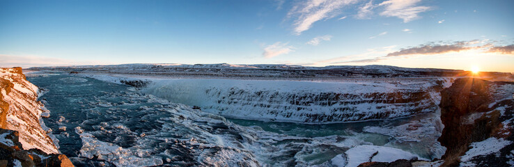 Panoramic view of small icy river