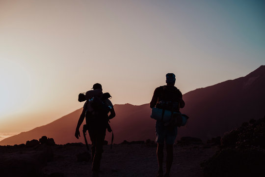 Hikers walking at sunset in Guajara Mountain in el Teide