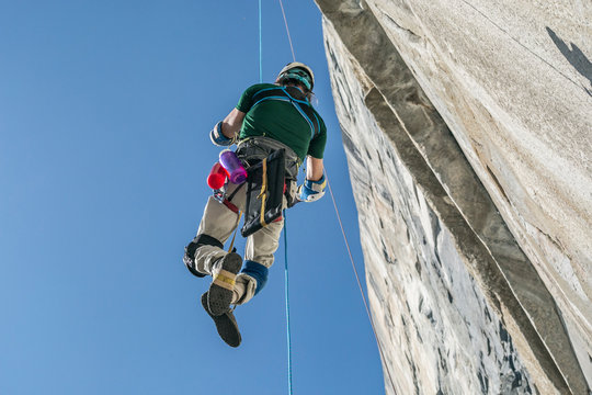 Adaptive climber ascends a rope to climb el cap