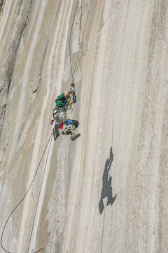 Adaptive climber pulling up on el Capitan