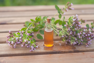 Essence of lavender flowers on table in beautiful glass Bottle
