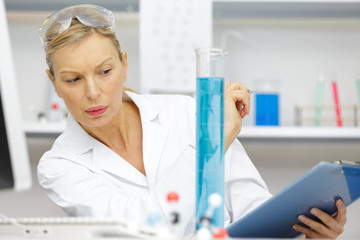 woman work with pcr dispenser in the laboratory of genetics