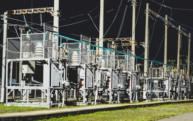 High-voltage electrical substation at night