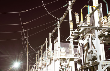 High-voltage electrical substation at night