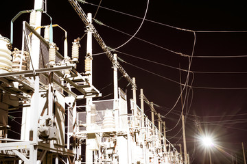 High-voltage electrical substation at night