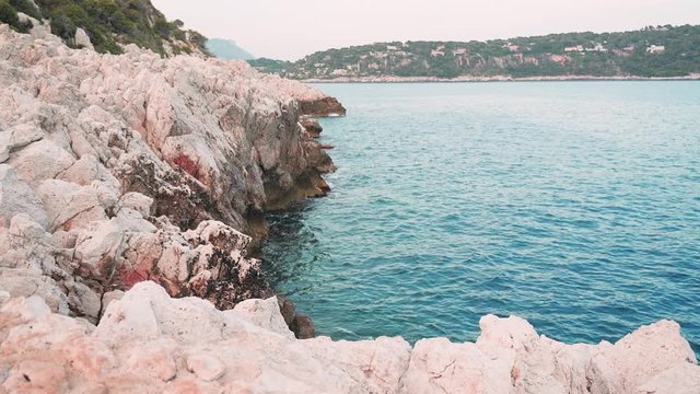 Beautiful white rocks formation by the sea in Pointe des Sans Culottes, Nice, France.