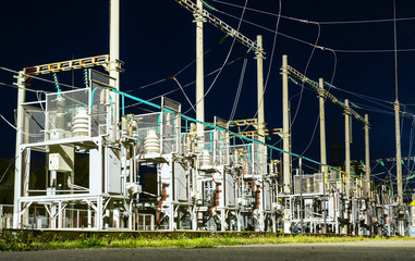 High-voltage electrical substation at night