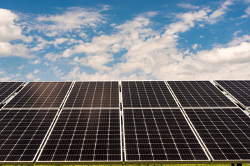 Sections of solar panels on the blue sky background