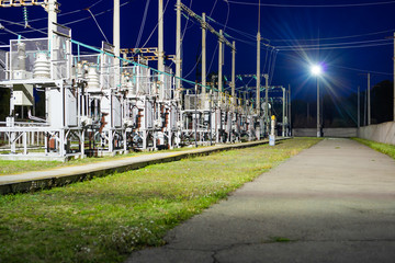 High-voltage electrical substation at night