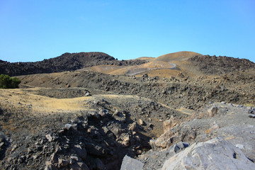 Wolcanic landscape of the island of Nea Kameni on the coast of Santorini
