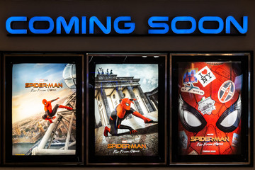 Naklejka premium Bangkok, Thailand - Jun 26, 2019: Spider-Man: Far From Home movie poster with coming soon display showing in theatre. Cinema promotional advertisement, or film industry marketing concept