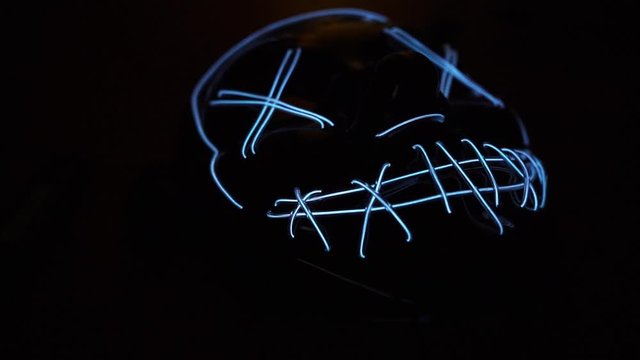 Scary / creepy glowing LED  mask. Close up slow motion footage.