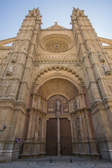 Fototapeta na wymiar The beautiful Catedral-Basílica de Santa María de Mallorca church in Palma de Mallorca on a sunny day.