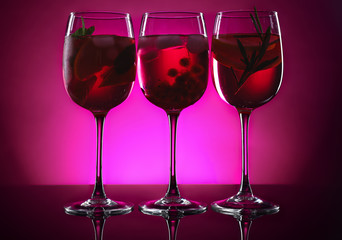 Different tasty cocktails on dark color background