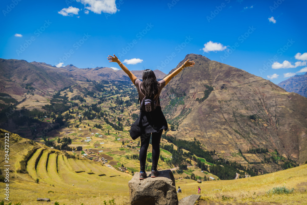 Wall mural tourist contemplating the landscape of the sacred valley in pisac, peru