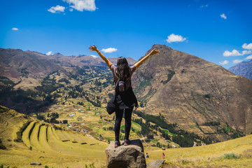 Tourist contemplating the landscape of the Sacred Valley in Pisac, Peru - obrazy, fototapety, plakaty