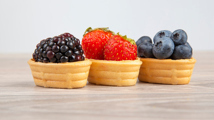 Blackberry, Strawberry Blueberry in a waffle basket. Vitamins and wholesome foods