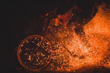 Riding bicycle through fire