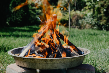Lighting a bonfire. The concept of spending free time outdoors. Lighting a bonfire made of wood....