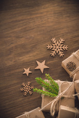 Christmas season. Gift box with spruce branch on the rustic table