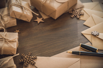 Christmas season. Blank envelopes with luxury pen on the rustic table
