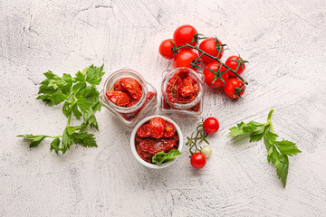 Composition with tomatoes and herbs on light table