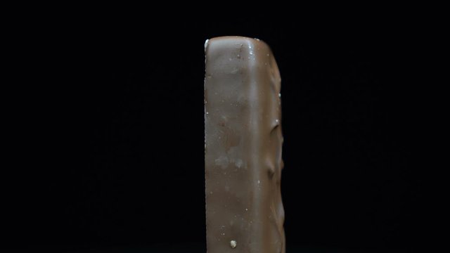 Chocolate bar rotating on a black background