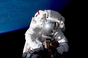 Astronaut in outer space in a spacesuit. Elements of this image were furnished by NASA.