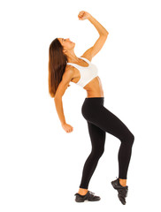 Sexy fitness woman posing in studio - isolated on a white background