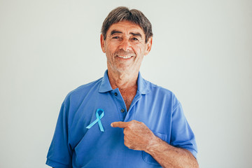 Prostate Cancer Awareness. Man with light Blue Ribbon for supporting people living and illness. Men...