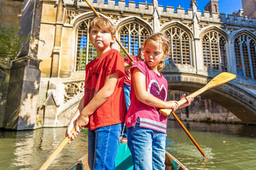 Father with children on family punting in Cambridge