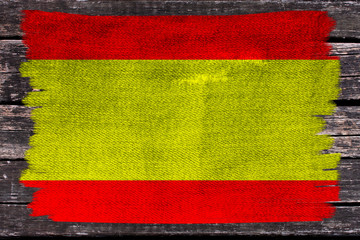 photo of the beautiful colored national flag of the modern state of Spain on a textured fabric, concept of tourism, economics and politics, closeup