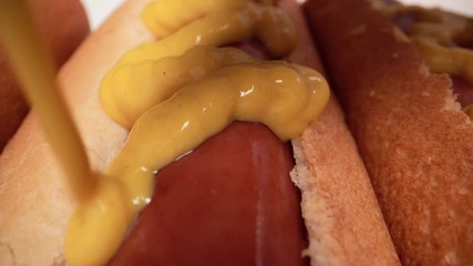 Extreme Close Up Hot Dogs With Mustard Squeeze